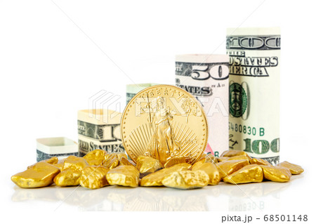 golden american eagle one ounce coin laying on golden nuggets golden american eagle one ounce coin laying on golden nuggets 68501148