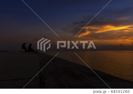silhouette of fishermen at the lake with twilight 68501260