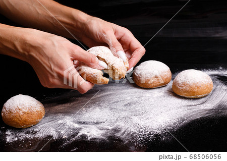 Homemade pastries. White buns are separated by hand. Photo of baking. 68506056
