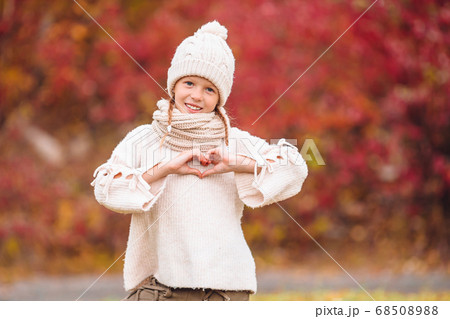 Adorable little girl at beautiful autumn day outdoors 68508988