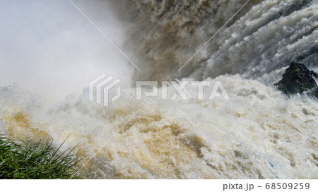 Iguazu waterfalls with the blue sky in Iguazu National park in Argentina 68509259