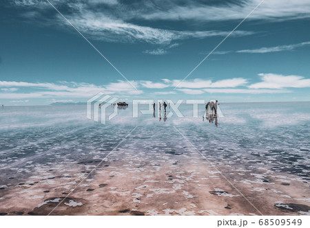 People silhouette and reflections in the Salar de Uyuni, Bolivia 68509549