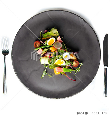 Isolated summer salad with quail eggs Isolated summer salad with quail eggs 68510170