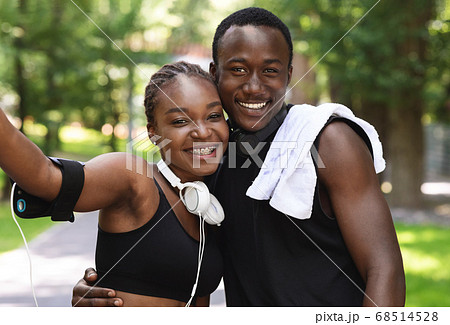 Happy Black Girl Making Selfie With Her Boyfriend After Training Outdoors Together Happy Black Girl Making Selfie With Her Boyfriend After Training Outdoors Together 68514528