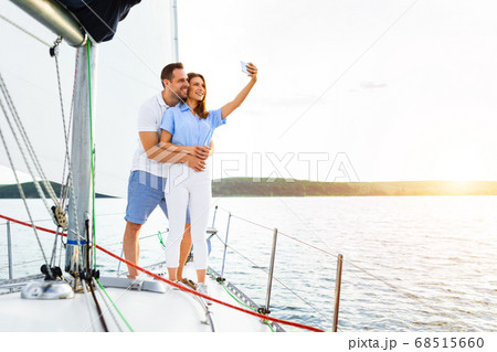 Lovely Couple Standing On Yacht Making Selfie During Boat Tour 68515660