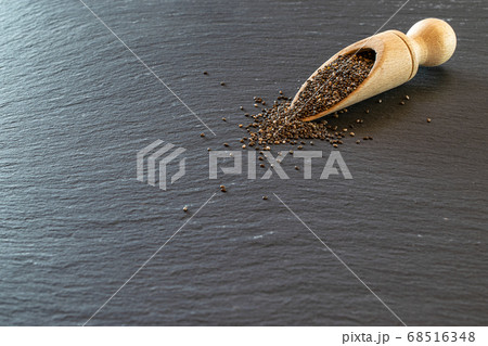 Chia healthy flax seed in wooden spoon. Pile Chia healthy flax seed in wooden spoon. Pile 68516348