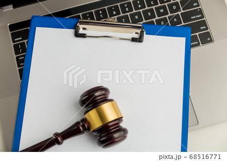 An empty application form of document and wooden gavel isolated. An empty application form of document and wooden gavel isolated. 68516771