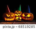 Halloween pumpkin head jack lantern on dark wooden background 68519285