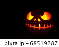Ghastly Halloween pumpkin head jack lantern on black background 68519287