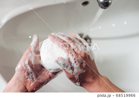 Man washing hands to protect against the coronavirus Man washing hands to protect against the coronavirus 68519966