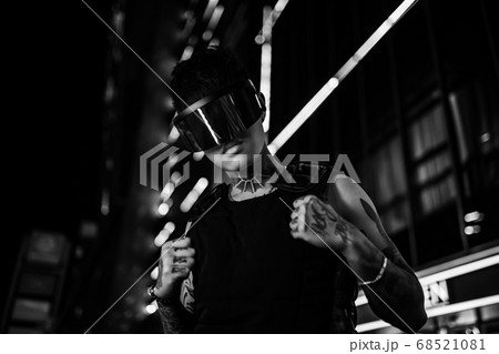 Black and white cyberpunk. The guy in stylish glasses. Man in the night city. 68521081