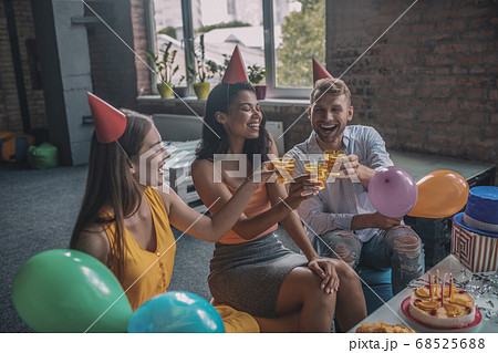 Joyful young friends drinking alcohol during the birthday party 68525688