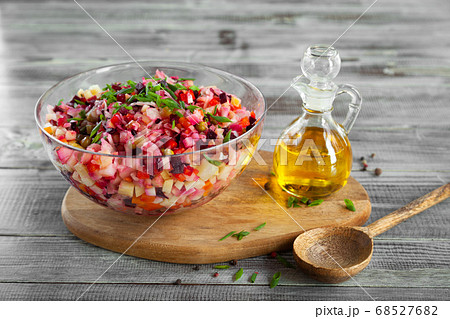 Bowl of vinaigrette beetroot traditional salad, wooden board, spoon Bowl of vinaigrette beetroot traditional salad, wooden board, spoon 68527682