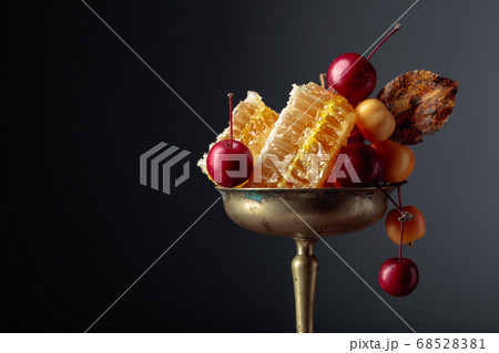 Red and yellow crab apples with honey, healthy 68528381