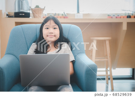 Cute girl student play laptop and study online 68529639