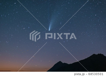 comet Neowise twin tails glowing in the night sky. comet Neowise twin tails glowing in the night sky. 68530501