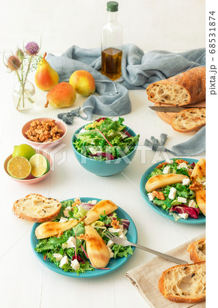 Caramelised Pears, Feta Cheese and Walnuts Salad with white wooden table background. 68531874