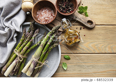 Asparagus on old wooden background. Asparagus on old wooden background. 68532339