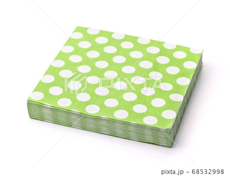 Stack of green dotted paper napkins 68532998