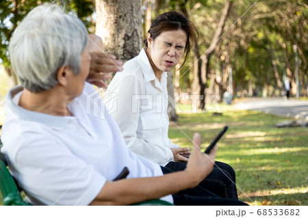 Sick woman with fever,cough and sneezing without protection,air spreading germs,contagion of Covid-19 with a contaminated patient,symptoms of influenza,Coronavirus pandemic,respiratory infections 68533682