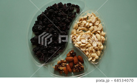 Top closeup view of delicious nuts in plastic transparent containers 68534070