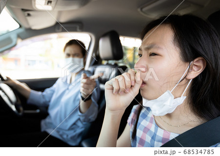 Sick child girl opened a protective mask while coughing,woman is spreading flu,cold,Covid-19 or Coronavirus,manners for cough,sneeze,daughter was scolded by her mother about the etiquette of coughing Sick child girl opened a protective mask while coughing,woman is spreading flu,cold,Covid-19 or Coronavirus,manners for cough,sneeze,daughter was scolded by her mother about the etiquette of coughing 68534785