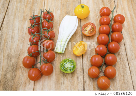 red tomatoes, yellow and scallions 68536120