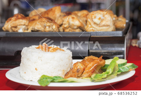 Grilled chicken in Rujak sauce at farmers street food market at Prague, Czech republic 68536252