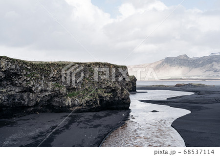 Black sand beach and the basalt mount Reynisfjall, Vik, Iceland. Black sand beach and the basalt mount Reynisfjall, Vik, Iceland. 68537114