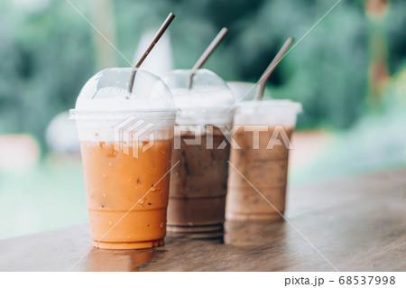 Closeup thai milk tea and chocolate on wood table Closeup thai milk tea and chocolate on wood table 68537998