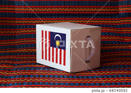 Malaysian flag on white box with stripe background, Paper packaging for put products. 68540092