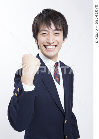 ガッツポーズをする男子高校生の写真素材