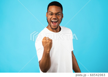 African Man Shaking Fist Gesturing Yes Celebrating Success, Studio Shot African Man Shaking Fist Gesturing Yes Celebrating Success, Studio Shot 68542063