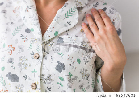 Warm kit homewear. Soft cotton cardigan. Comfortable clothes for healthy sleep. Pajamas concept. Close-up. Warm kit homewear. Soft cotton cardigan. Comfortable clothes for healthy sleep. Pajamas concept. Close-up. 68547601