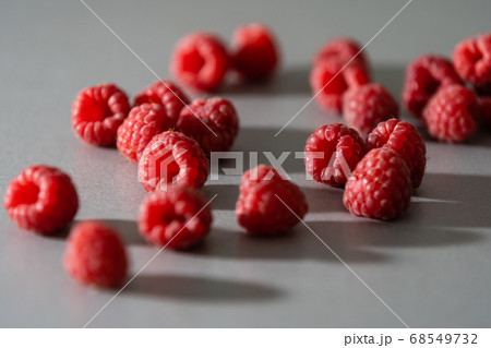 red Raspberry fruit on gray background chocolate 68549732
