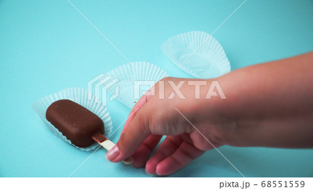 Ice cream on a stick on a blue background 68551559