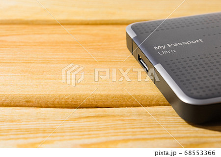 external hard drive on a wooden background top view external hard drive on a wooden background top view 68553366