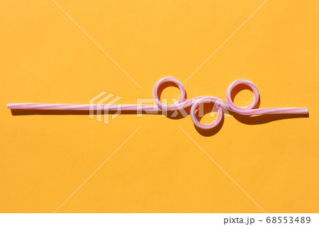 tubes for drinks on a yellow background macro. place for the label tubes for drinks on a yellow background macro. place for the label 68553489