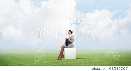 Attractive business lady or accountant outdoors on white box 68556207