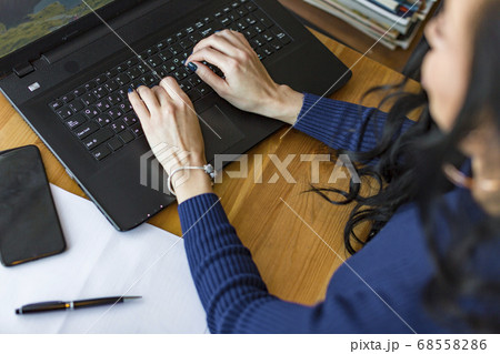 Charming funny female students making homework sitting in college library Charming funny female students making homework sitting in college library 68558286