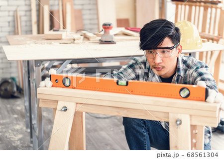 Carpenter Man is Working Timber Woodworking in Carpentry Workshops Carpenter Man is Working Timber Woodworking in Carpentry Workshops 68561304