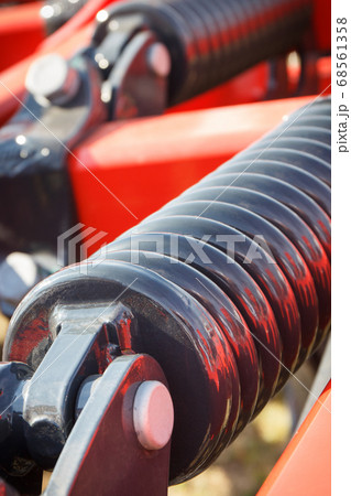 Steel spring in industrial or agricultural machine Steel spring in industrial or agricultural machine 68561358