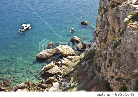 View of the Tremiti Islands. Boats near a rock 68561648