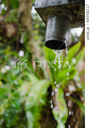 Rain Pouring Down from The Gutter. Rain Pouring Down from The Gutter. 68568217
