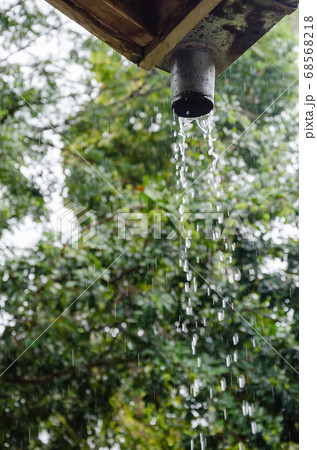 Rain Pouring Down from The Gutter. Rain Pouring Down from The Gutter. 68568218