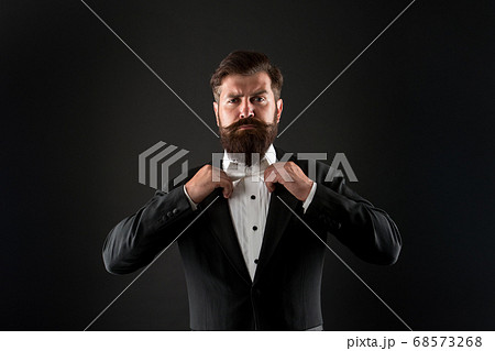 Bearded man with bow tie. Well dressed and 68573268