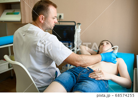A mammologist makes breast ultrasound scanning 68574255