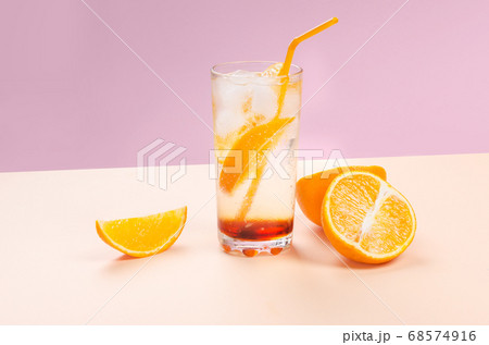 Orange alcohol cocktail with orange fruit slice on color background Orange alcohol cocktail with orange fruit slice on color background 68574916
