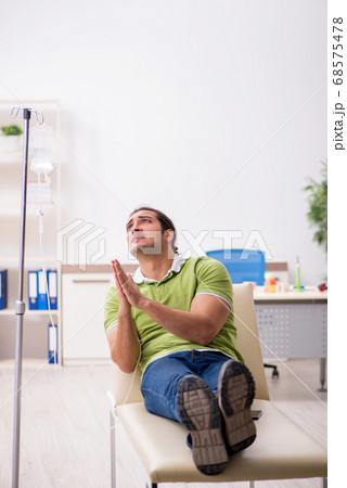 Young male patient in blood transfusion concept 68575478