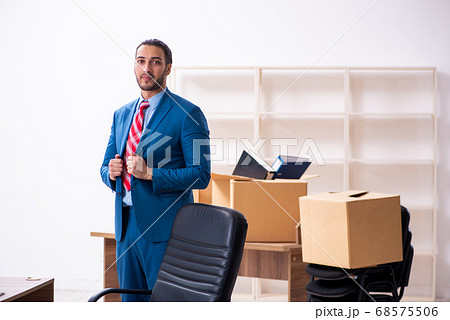 Young male employee in relocation concept 68575506
